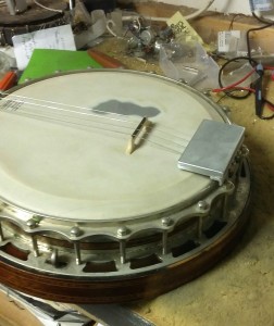 Here's a lovely Clifford of Essex Tenor banjo that I custom-made an extra-large tailpiece for, to accommodate the owner's large hands.